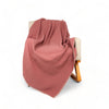 Pink stripe throw blanket on chair