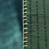 Close-up of green stripe throw blanket edge