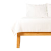 White stripe throw blanket on bed