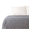 Gray Earthy Cobblestone Blanket on bed with pillows