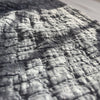 Close-up texture of gray Earthy Cobblestone Blanket