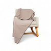 Beige waffle throw blanket on chair